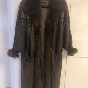 Leather ( embossed) and fox fur full length coat.  Excellent condition.
